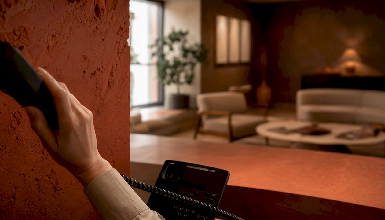 Medical office phone held to ear
