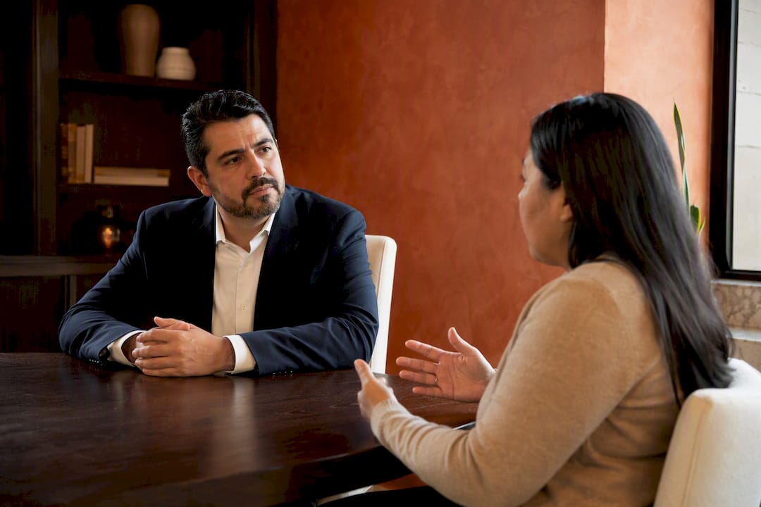 Attorney conducting bilingual legal intake conversation