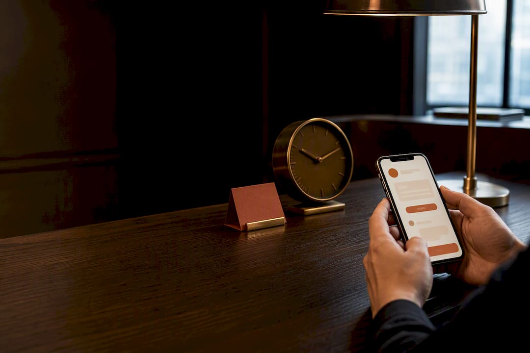Hands reviewing a WhatsApp appointment reminder