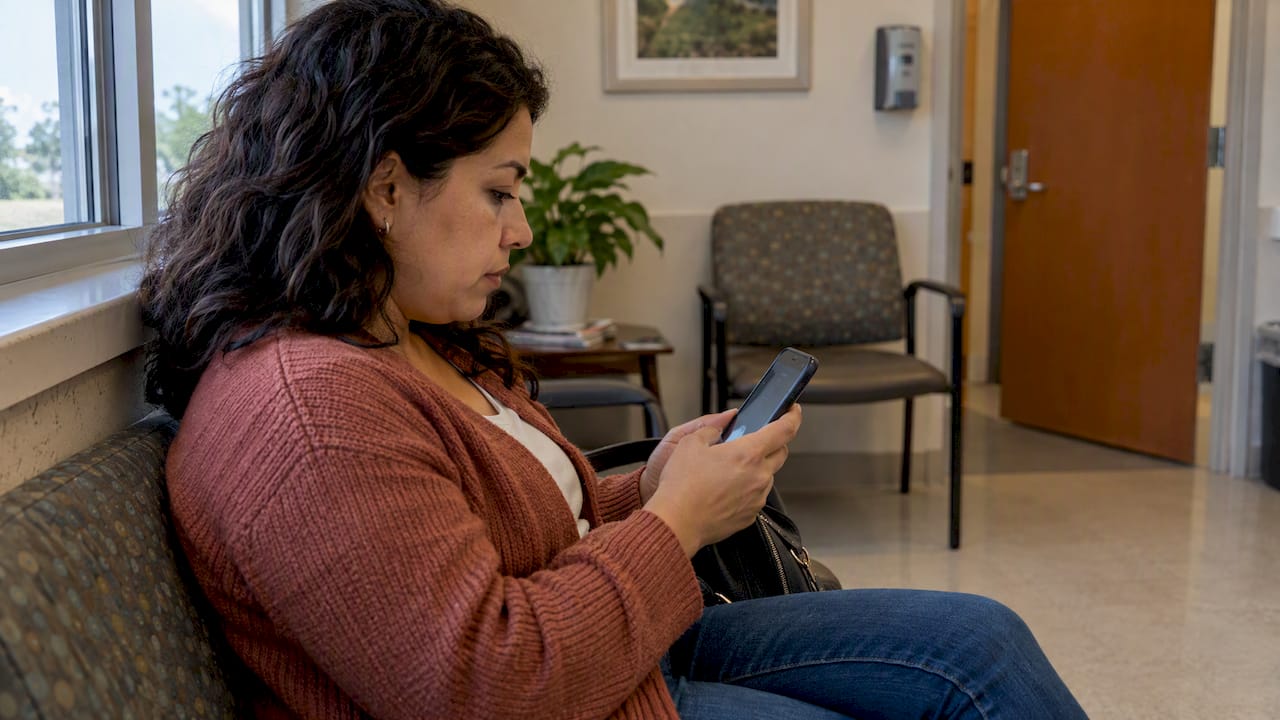 Patient using a clinic website on her phone